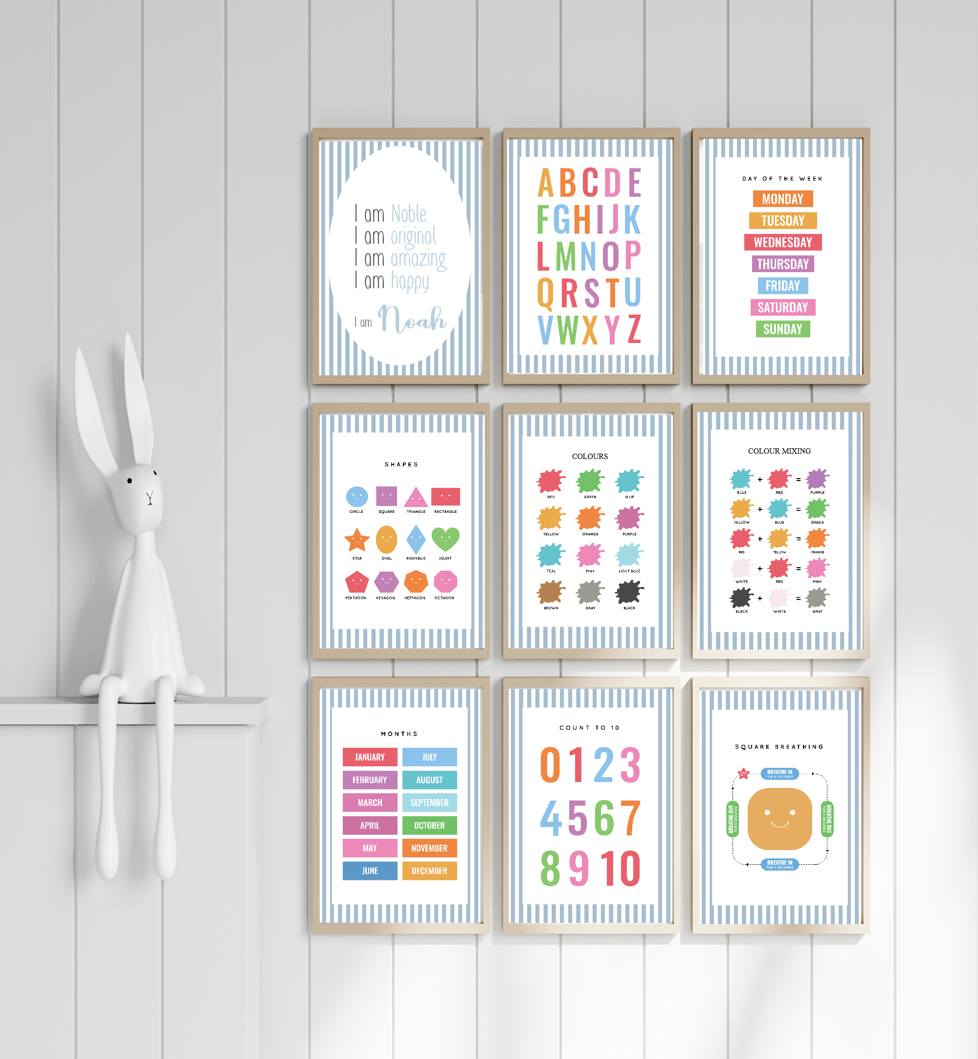 Set of colorful educational posters on a wooden wall with a white shelf.