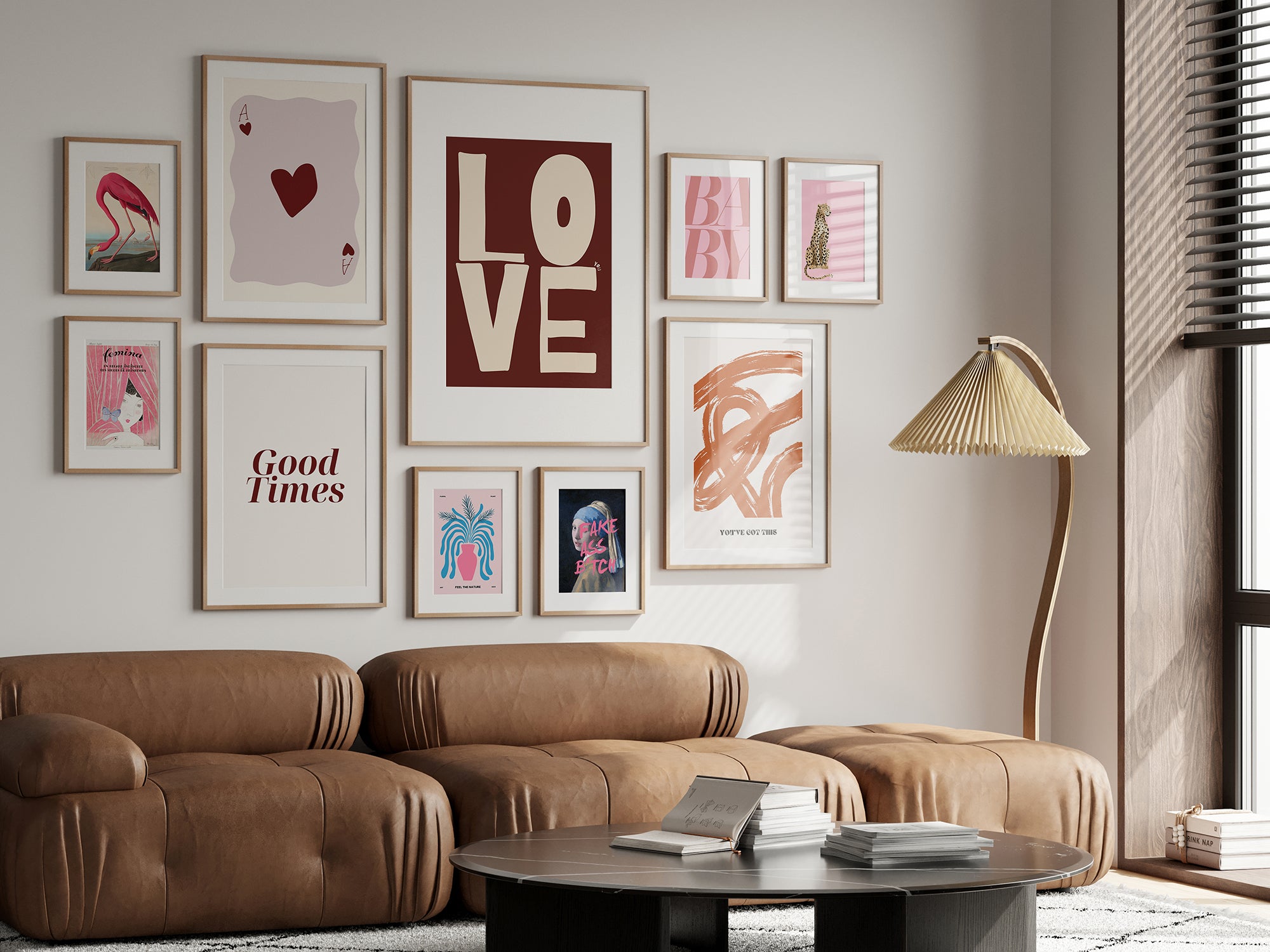 Living room with brown leather sofa, coffee table, and wall art