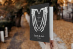 Set of two personalised gothic wedding vow books with skeleton hands
