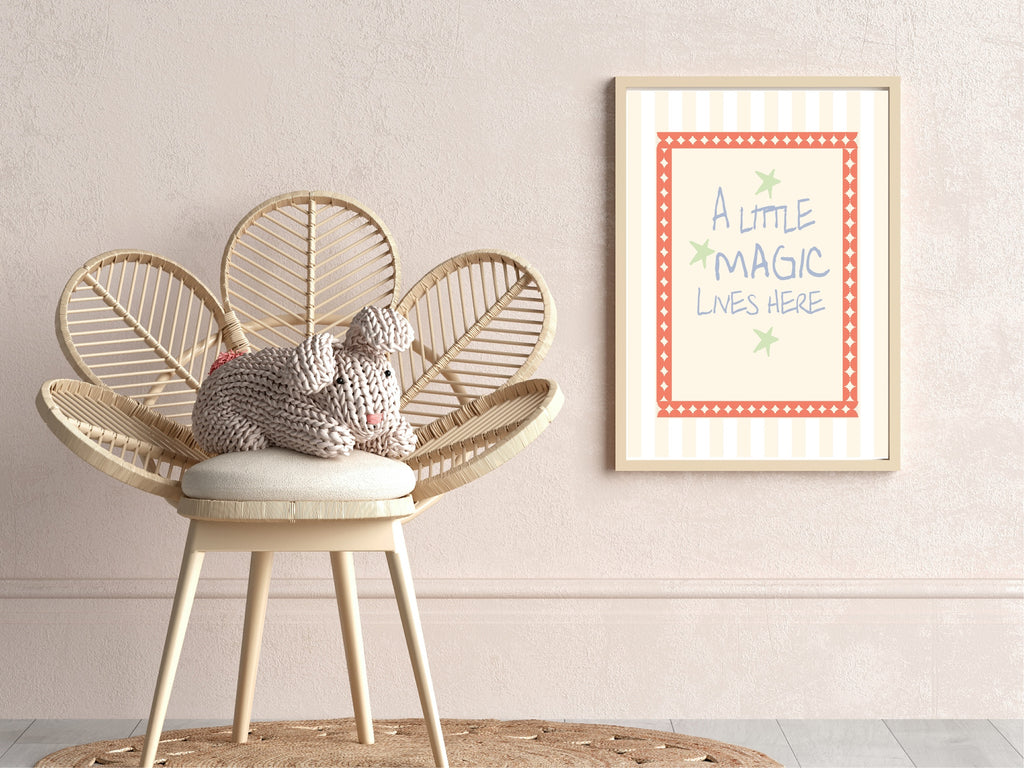 Wicker chair with a cushion and knitted toy, framed artwork on the wall.