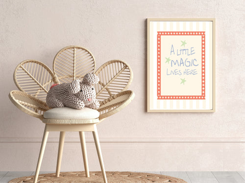 Wicker chair with a cushion and knitted toy, framed artwork on the wall.