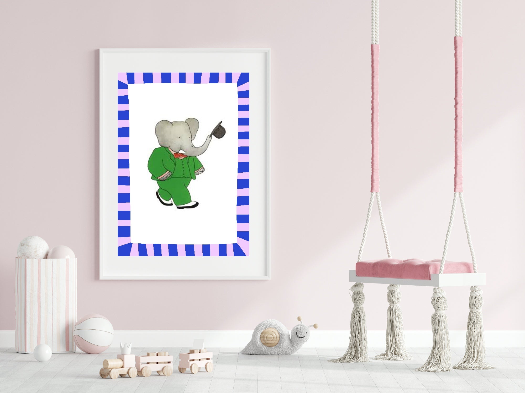 Framed artwork of an elephant in a green suit on a pink wall with a swing in the background.