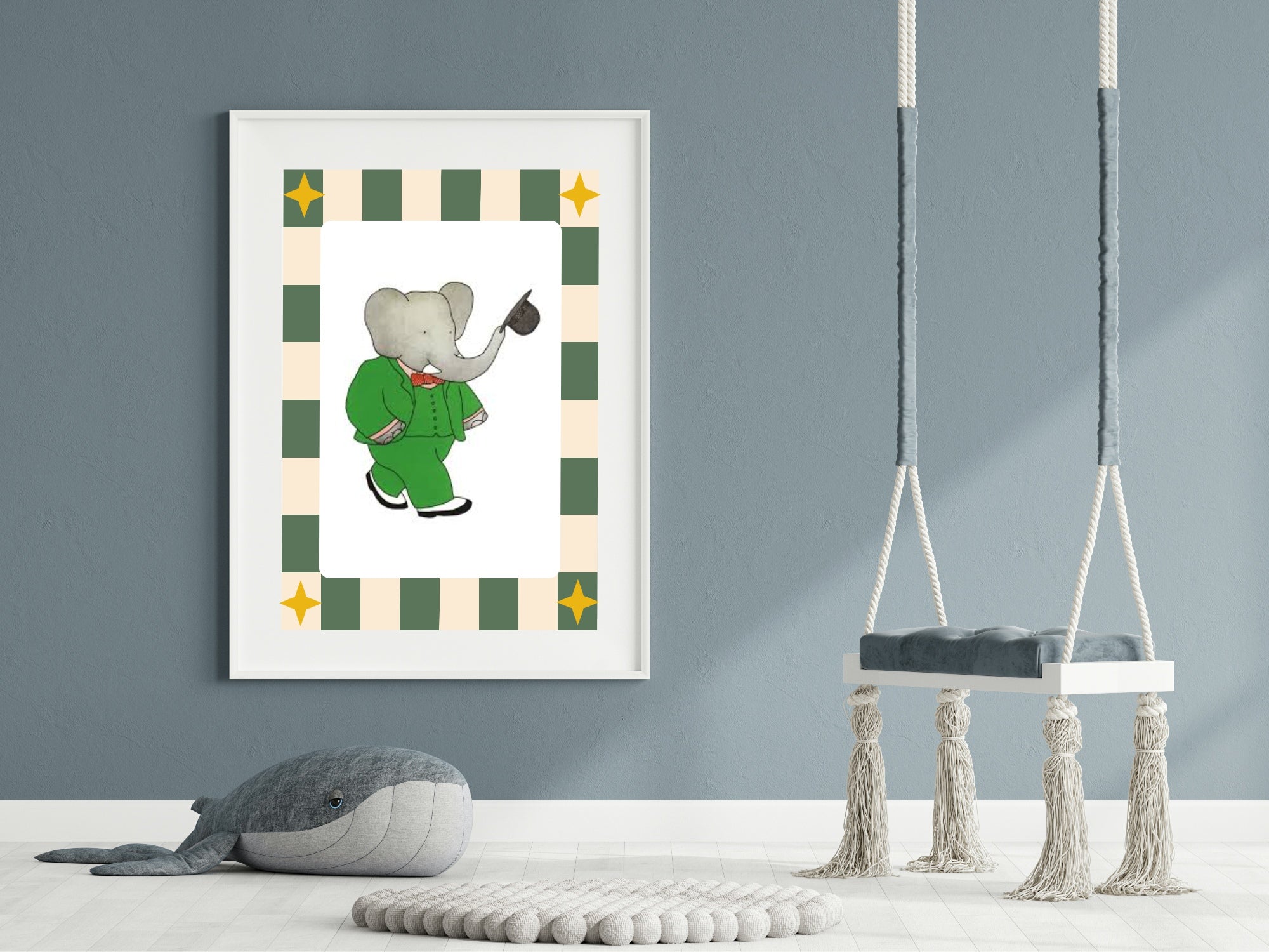 Framed children's illustration of an elephant in a green suit on a gray wall with two swings below.