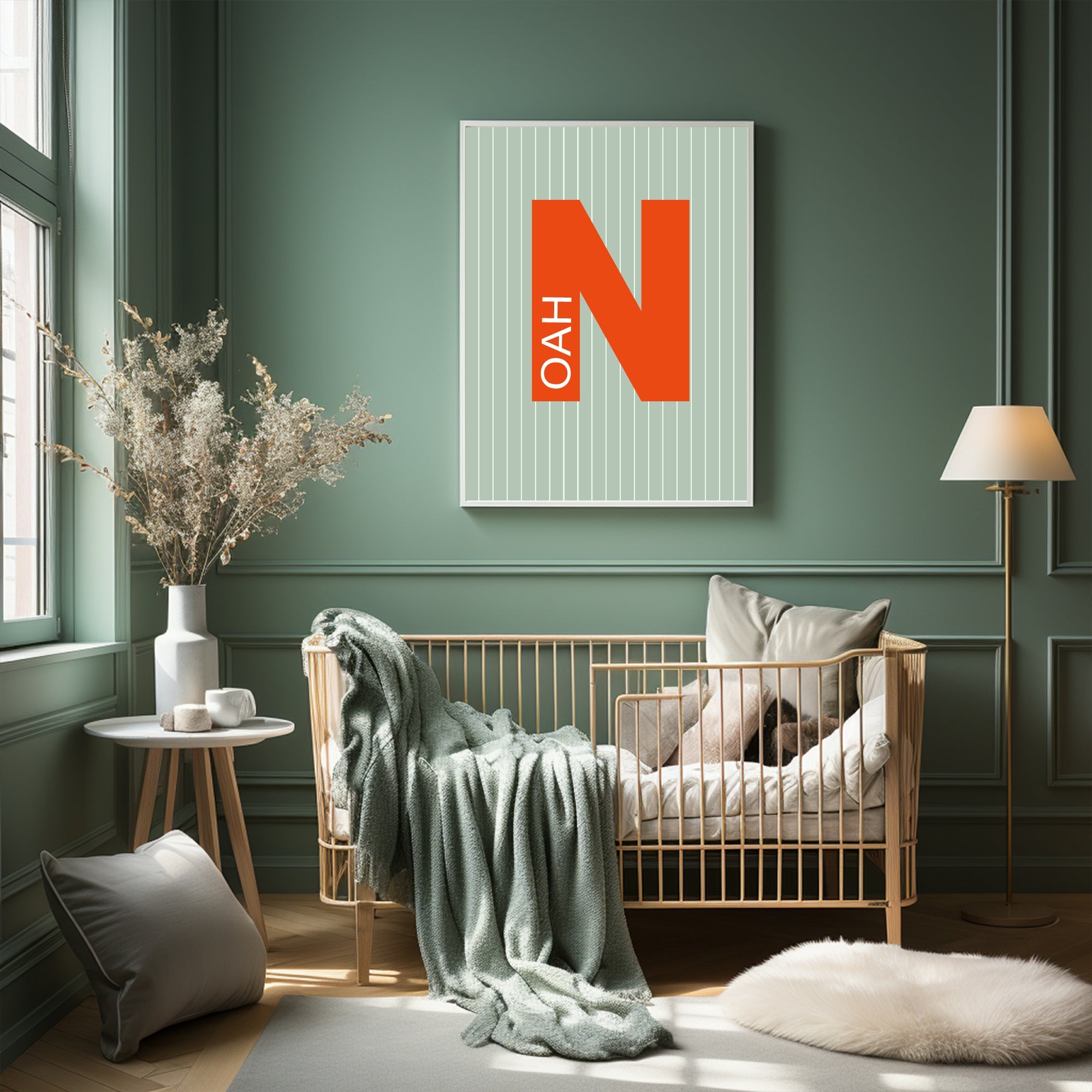 Nursery room with a crib, decorative pillows, and a framed picture on a green wall.