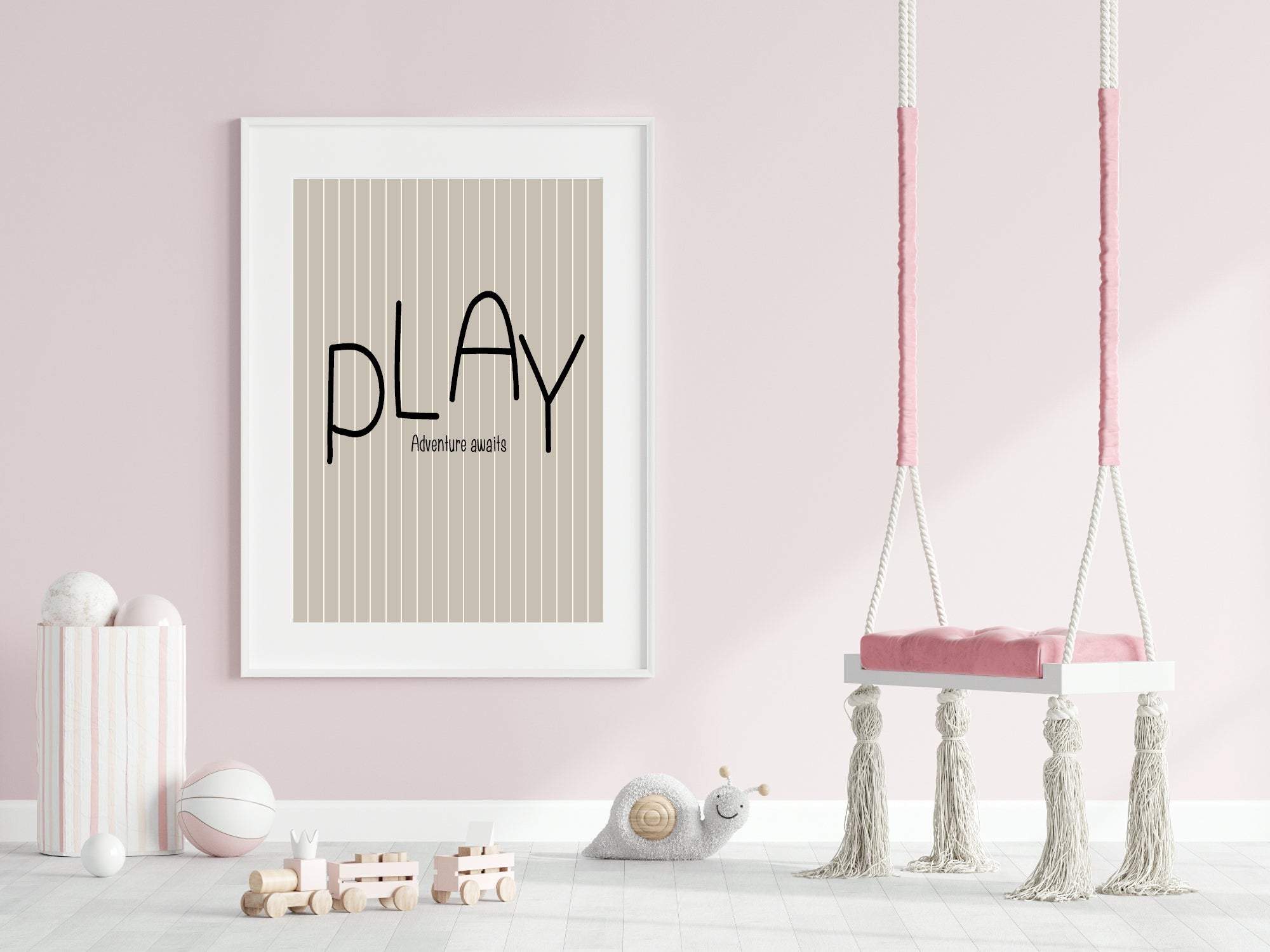 Children's room with 'PLAY' poster, pink swing, and toys on a light pink wall.
