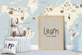Children's room with world map wallpaper, plush toy, and motivational poster.