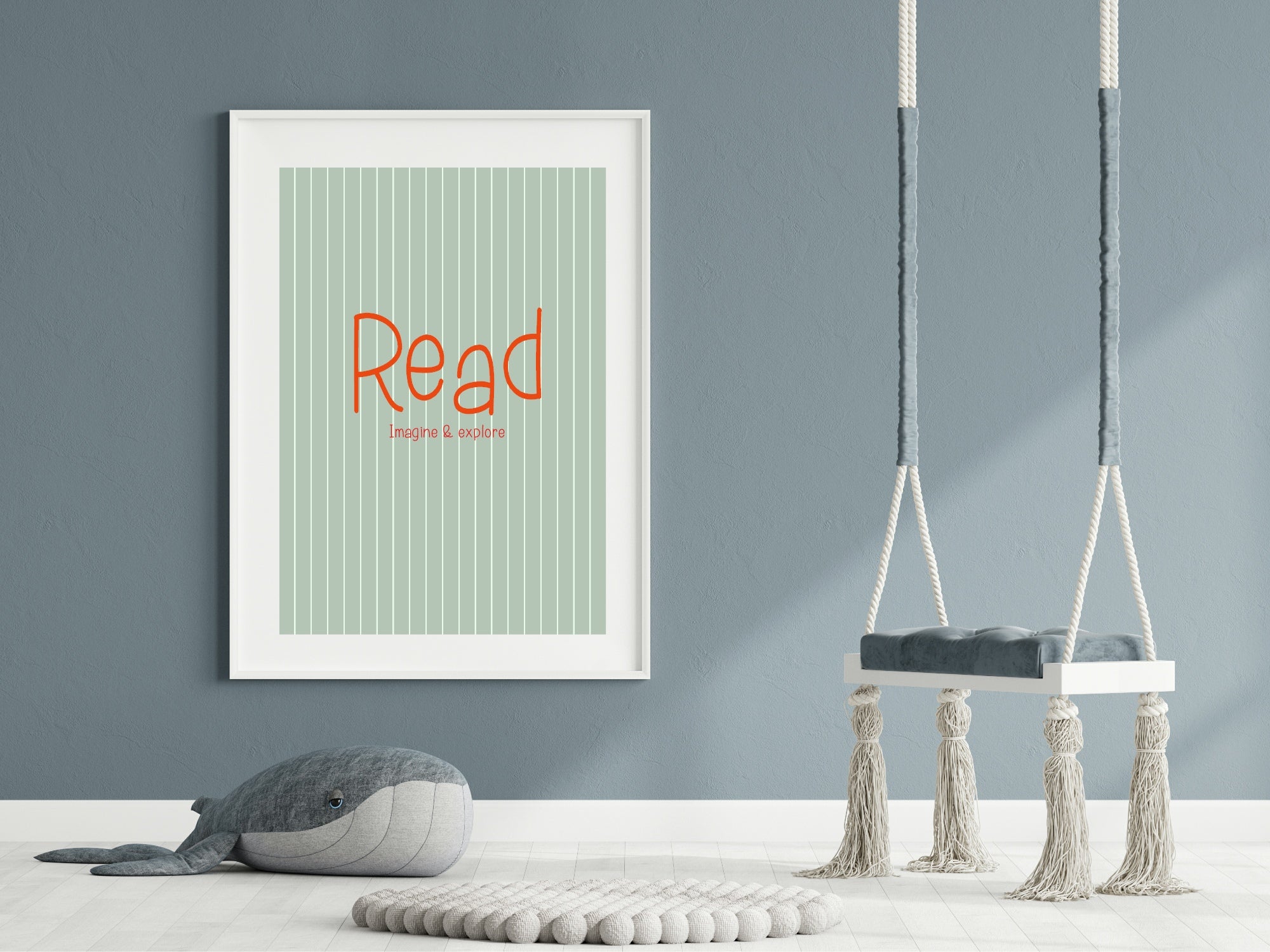 Framed poster with 'Read' text on a wall with two hanging swings.