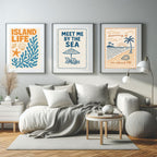 Living room with 'Island Life' and 'Meet Me by the Sea' wall art above a sofa.
