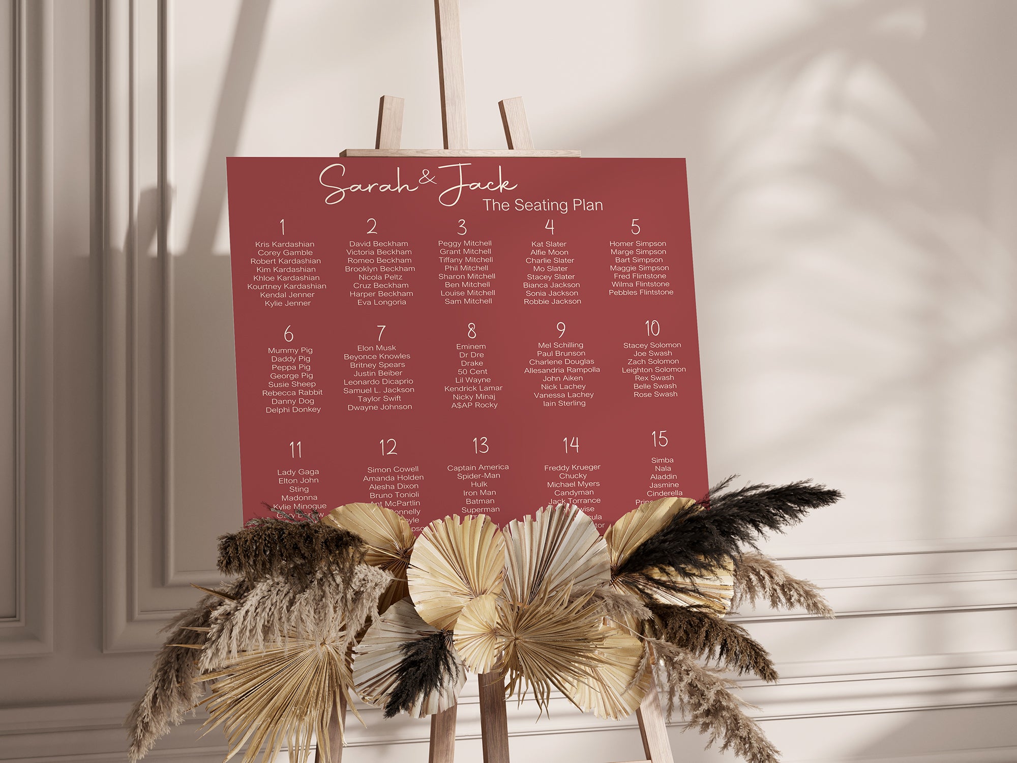 Seating plan for a wedding with decorative plants on a light background