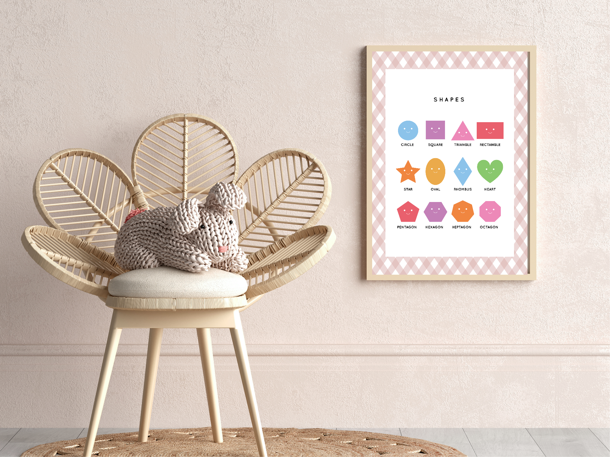 Wicker chair with a knitted mouse toy next to a framed educational poster on a wall.