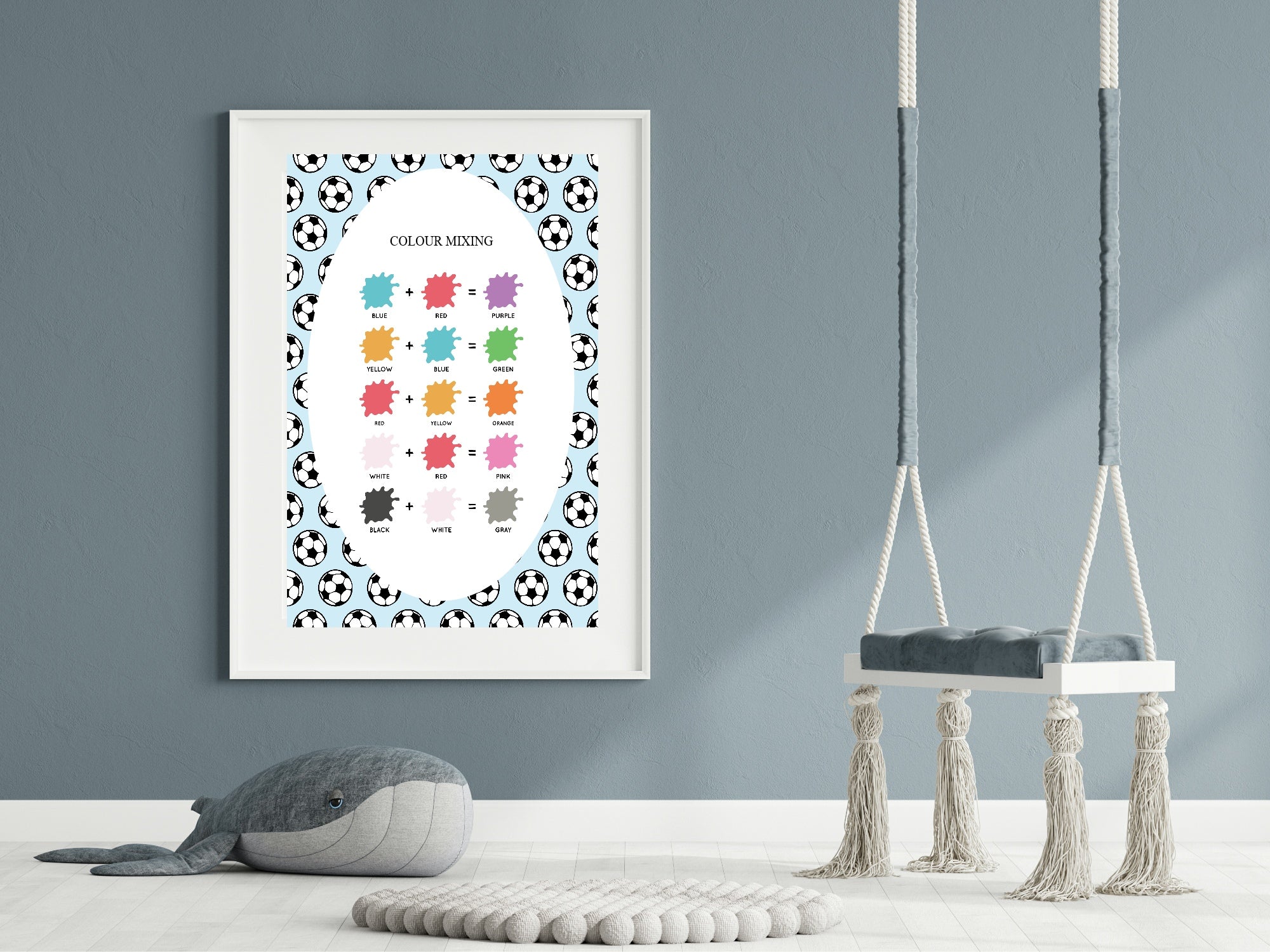 Color mixing chart with soccer ball pattern on a wall in a room with a swing and plush toy.
