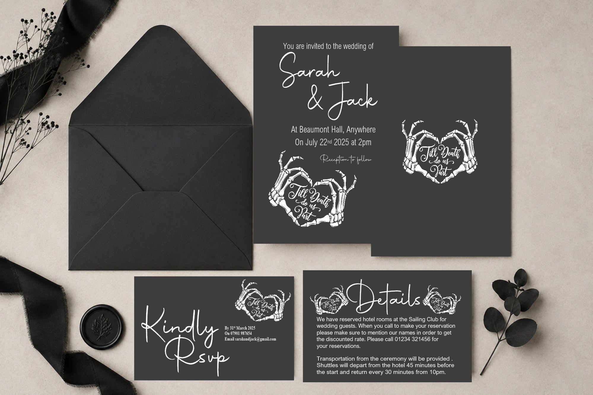 A wedding invitation suite laid out on a light neutral surface, including a black envelope, a main invitation card, a details card, and a RSVP card, all in dark charcoal with white script and antler/heart illustrations. Decorative black ribbon, dried flowers, and a wax seal are placed around the cards.