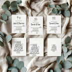 Set of wedding invitations with names and cake illustrations on a textured fabric background with eucalyptus leaves.