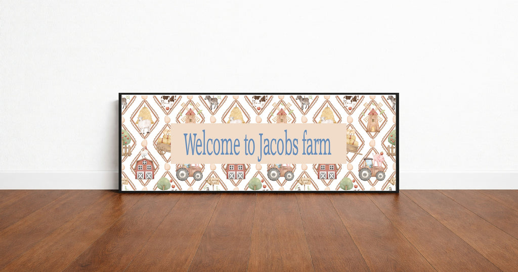 Decorative sign with 'Welcome to Jacobs farm' text on a wooden floor.