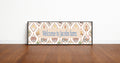 Decorative sign with 'Welcome to Jacobs farm' text on a wooden floor.