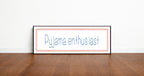 Framed picture with 'Pyjama enthusiast' text on a wooden floor and white wall background
