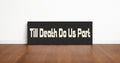 Till Death Do Us Part panoramic wall art print in a black frame standing on a wooden floor