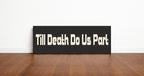 Till Death Do Us Part panoramic wall art print in a black frame standing on a wooden floor