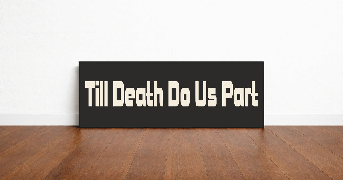 Till Death Do Us Part panoramic wall art print in a black frame standing on a wooden floor