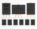 A coordinated wedding stationery set displayed on small wooden easels and shown as individual card views below. The set includes a guest book, unplugged sign, pick a seat sign, confetti sign, thank you sign, and table numbers, all in a dark charcoal/black finish with light wood easels and small gold accents.