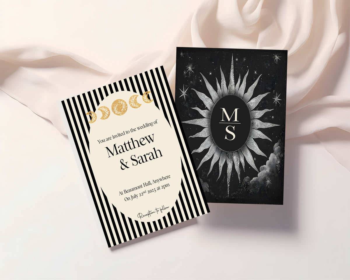 Black Celestial wedding invitation styled on soft fabric