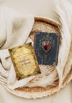 Blue Spell Book wedding invitation front and navy heart reverse on a woven tray