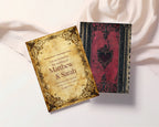 Red Spell Book wedding invitation parchment front beside red book-cover reverse on fabric
